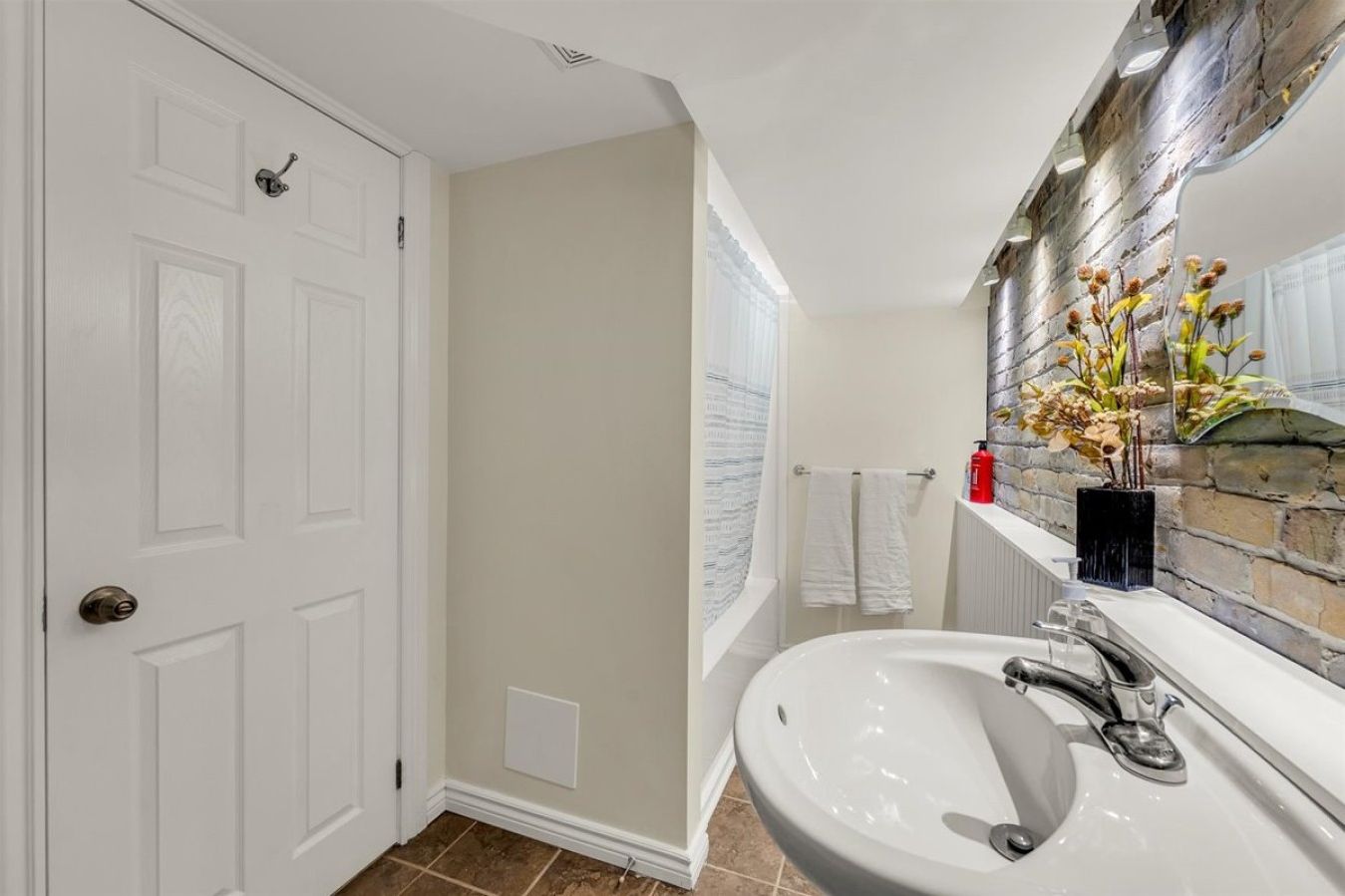 `Refresh in a clean, modern bathroom featuring contemporary fixtures and a sleek, neutral design.