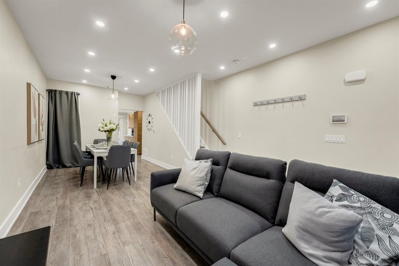 A seamless transition from the cozy living room to the elegant dining area, making it ideal for socializing.