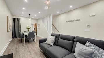A seamless transition from the cozy living room to the elegant dining area, making it ideal for socializing.