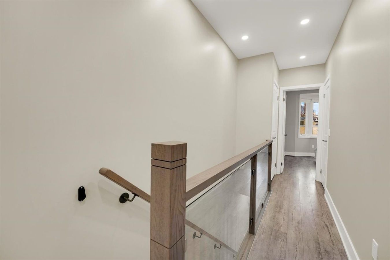 Clean, minimalist design with bright natural light leading to the private sleeping quarters.