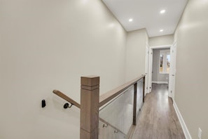 Clean, minimalist design with bright natural light leading to the private sleeping quarters.