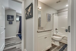A modern bathroom with a shower, toilet, and sink. - Spacious Condo With Spectacular Views (Branson)