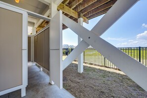 A covered outdoor area with a view of a residential neighborhood. - Sunset & Waterway Views! Holden Beach Getaway (Supply)
