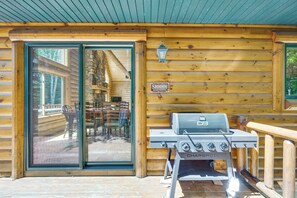 A wooden cabin with a glass door entrance, a barbecue grill, and a sign that reads 'SHHH BEARS NAPPING'. - Ski, Hike & Explore! Spacious Conway Cabin w/ Deck (Conway)