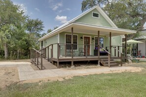 A single-story house with a porch, a small deck, and a front door. - Boutique Retreat Minutes From Round Top! (Fayetteville)