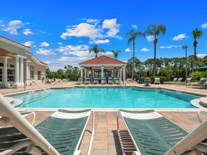 A pool area with lounge chairs and a gazebo. - PROMO Lovely 3 BR Villa, Resort Access - by Blue Sky Villas (Kissimmee)