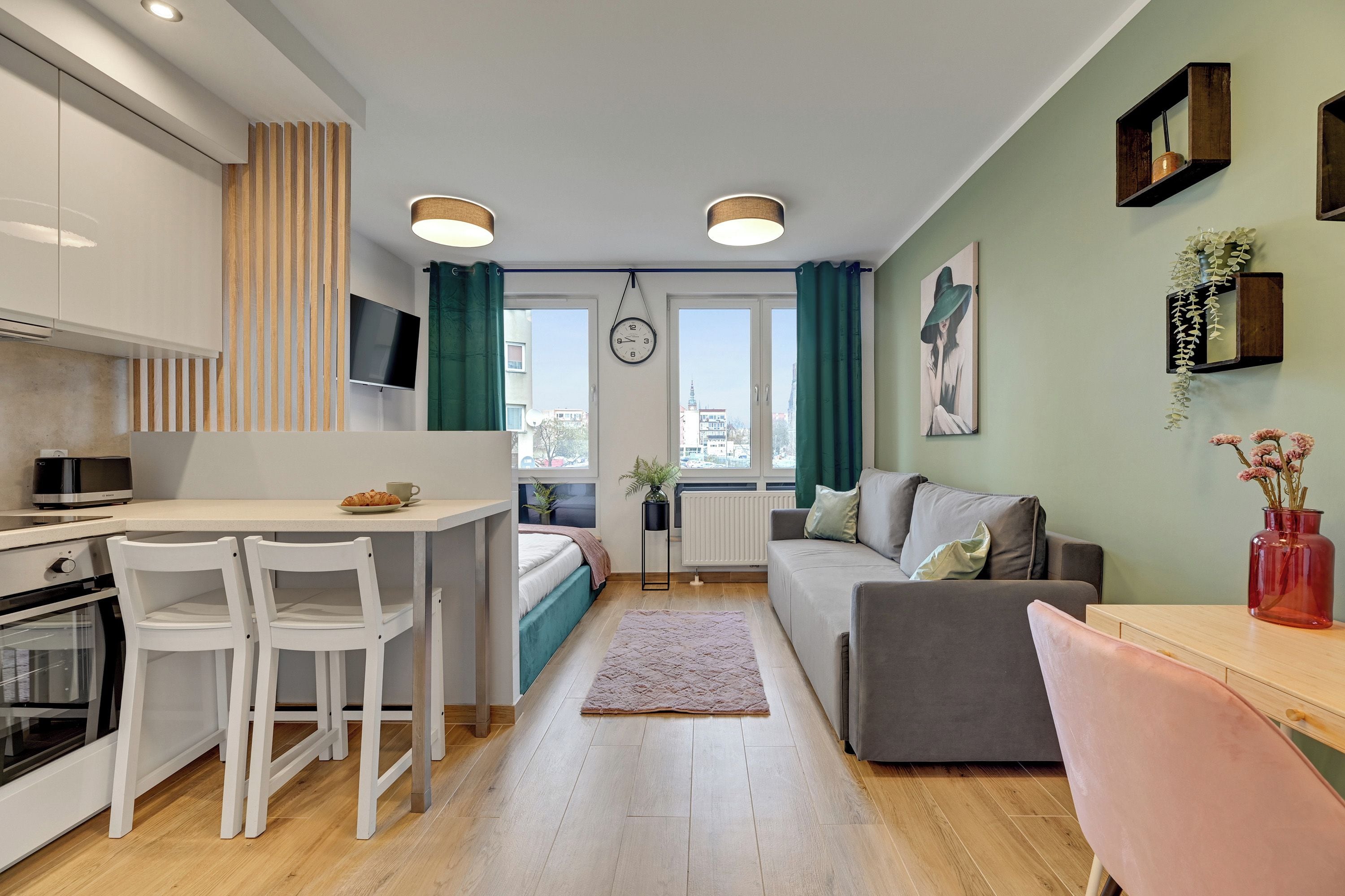 A compact living space with a kitchenette, dining area, and seating area.