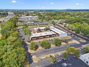 A multi-story parking garage with a central open area and multiple parking levels. - Sleek apt near The Grand Ole Opry and BNA Airport! (Nashville)