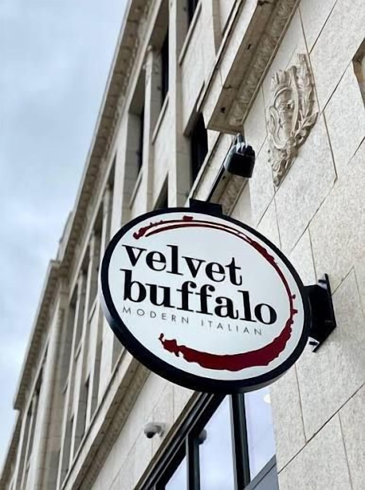 A sign for 'Velvet Buffalo Modern Italian' restaurant.