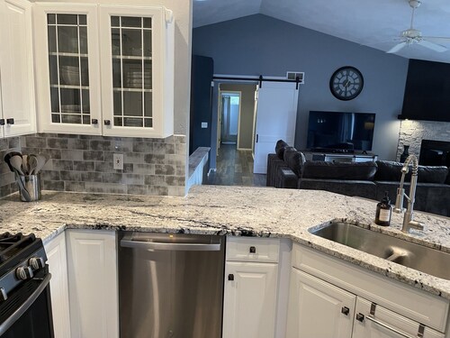 Wooded retreat on golf course with rec path. Modern decor w amazing outdoor area