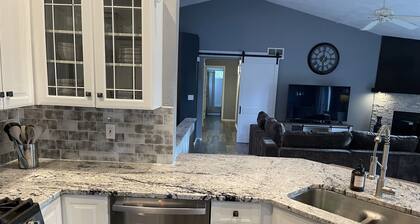 Wooded retreat on golf course with rec path. Modern decor w amazing outdoor area
