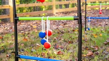 A playground with a seesaw and a climbing structure.