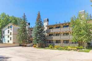 A multi-story building with balconies and a courtyard. - Villa Cortina 135 | 2BR Vail Village Retreat with Pool (Vail)