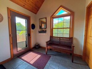 A wooden interior with a bench, a door, a window, and a mirror. - Nellie's Lodge-Outdoor Sauna, close to X-C Ski Trails (Ironwood)