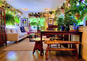 A cozy living room with a sofa, wooden coffee table, and a bench.