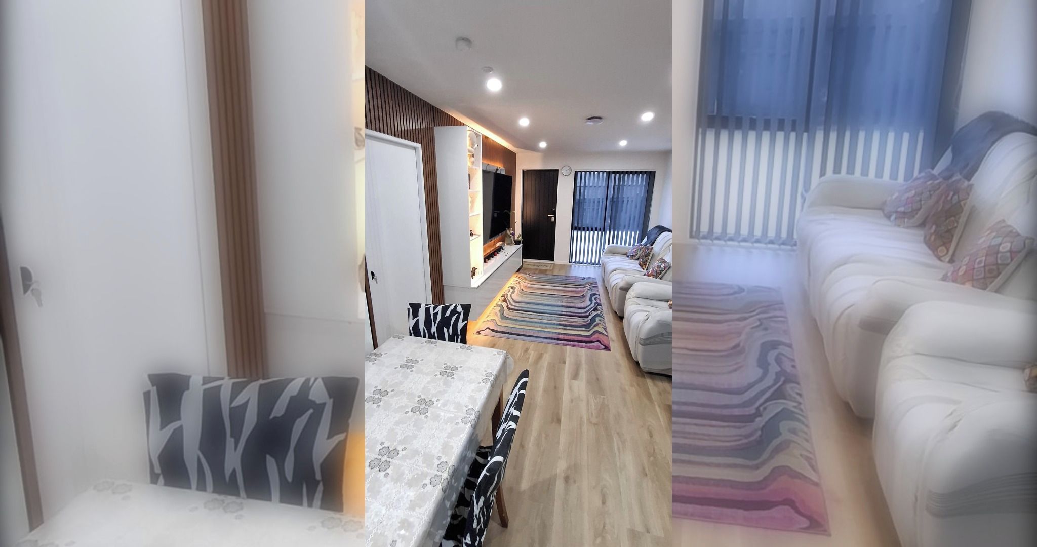 A modern living room with a sofa, a dining area with a table, and a TV.