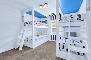 A children's room with bunk beds, a ladder, and a window with blinds. - Disney Area Villa w Private Pool & Resort Access (Davenport)
