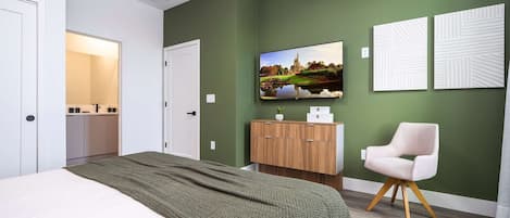 Une chambre à coucher moderne avec un lit, une télévision, une armoire et une chaise.