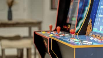 A close-up of a vintage arcade machine with colorful buttons and joysticks.