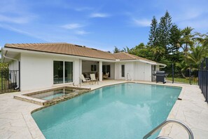 A house with a swimming pool, a patio with chairs, and a barbecue grill. - Upscale Bonita Springs  Pool, Spa & Privacy (Bonita Springs)