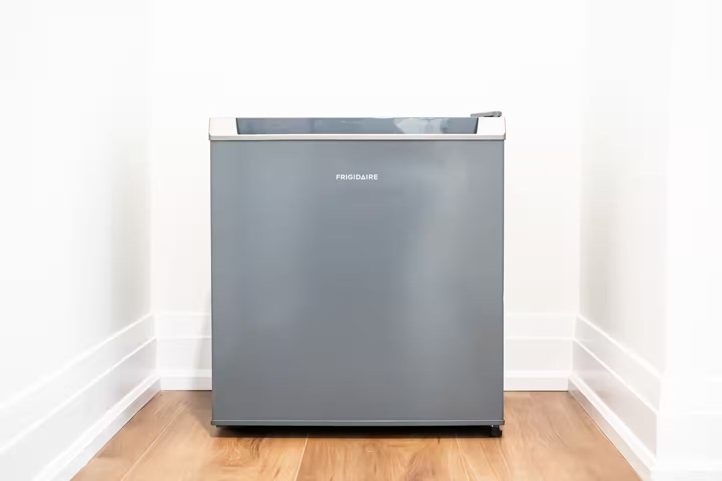 A gray, modern-looking appliance with the brand name 'FRIGIDAIRE' on the front.