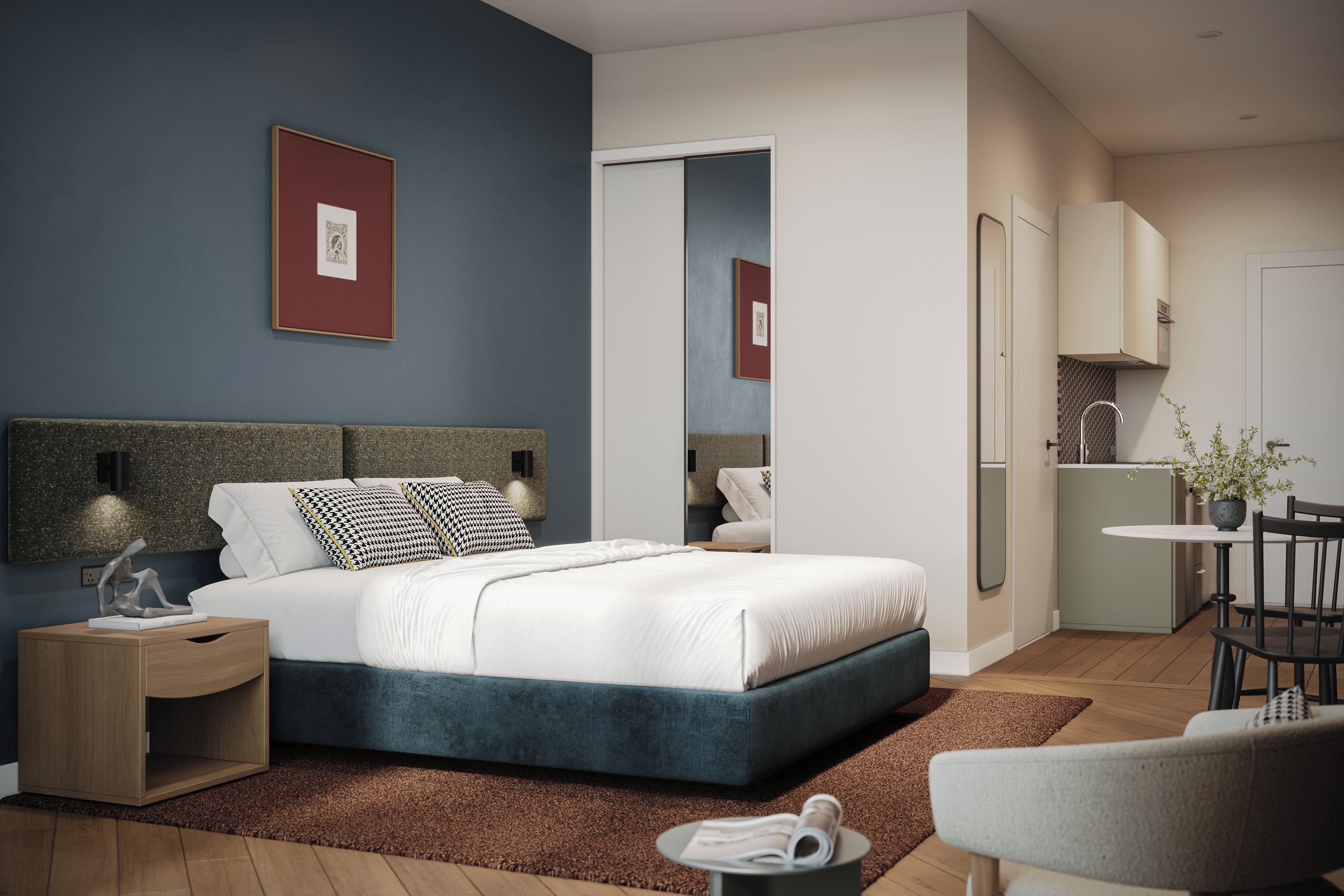 A modern bedroom with a large bed, bedside tables, a nightstand, a seating area with a chair, and a small table with a plant.