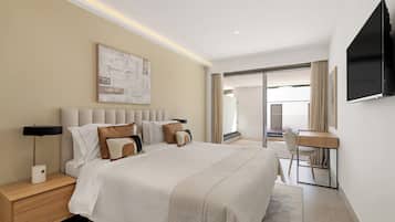 A hotel room with a bed, bedside tables, a desk, and a TV.