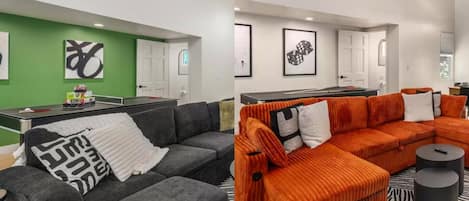 A modern living room with a sectional sofa, a grey couch, and a small table.