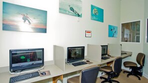 A modern office space with cubicles, computers, and artwork on the walls. - 4BR Bella Vida Home Near Disney for 11 Guests (Kissimmee)