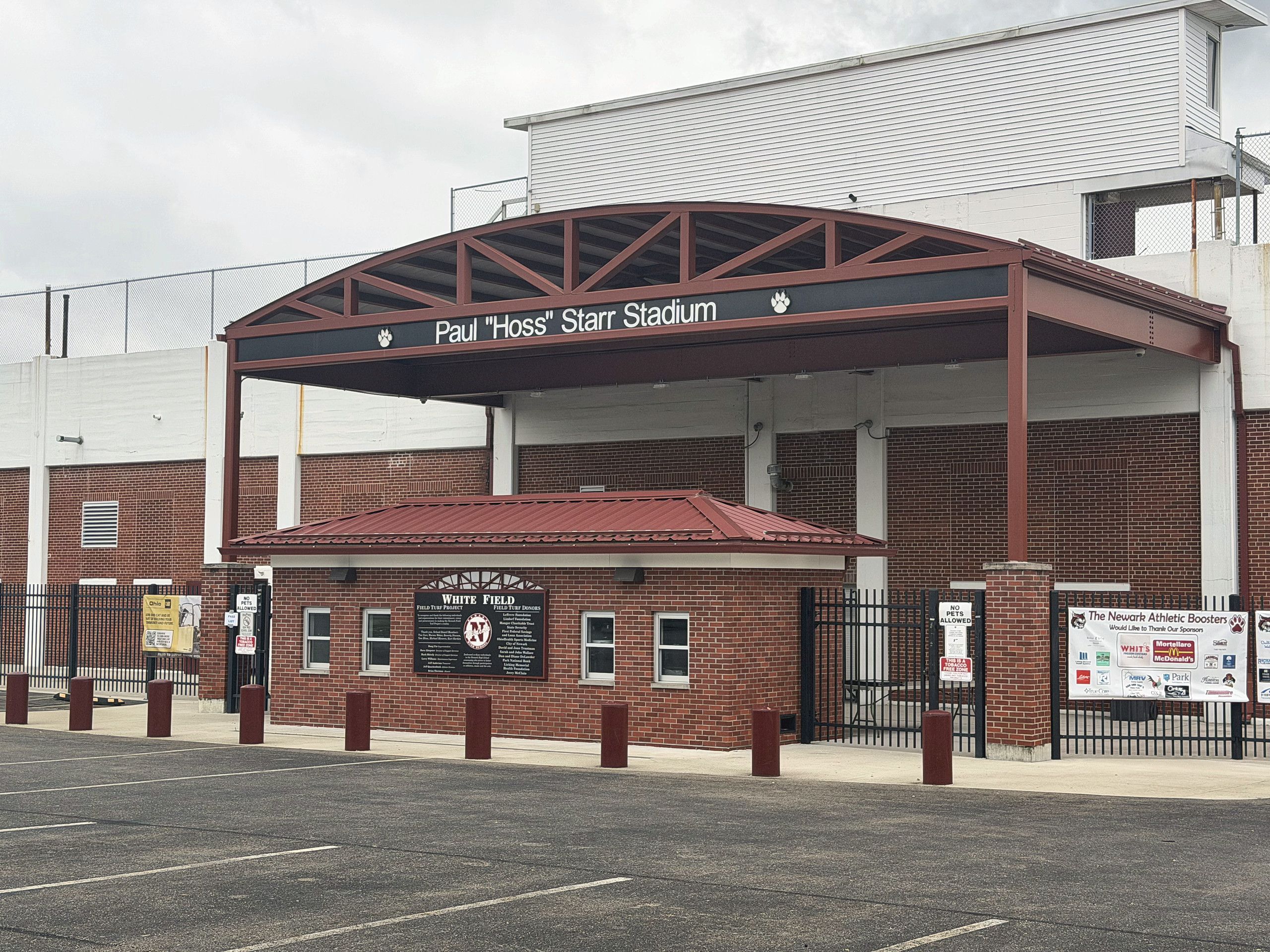 A stadium entrance with a sign for Paul 'Hoss' Stall Stadium.