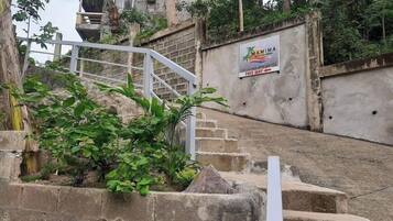 A staircase leading up to a building with a sign that reads 'MAMIMA.'