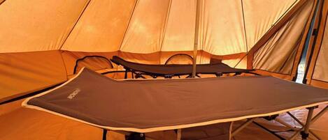 A tent with a table set up inside.
