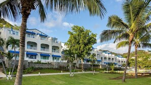 A resort with multiple-story buildings, a well-maintained lawn, and palm trees. - Studio at Limetree Beach Resort by Club Wyndham on Beautiful St. Thomas (Southside)