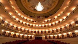 A multi-tiered theater with ornate balconies and a central chandelier. - Mérida Made for Groups | 3 Double Beds + Pool (Mérida)