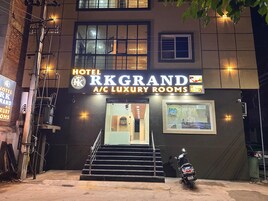 Hotel RK Grand with a sign indicating A/C Luxury Rooms.