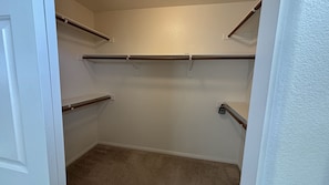 A walk-in closet with built-in shelves and a carpeted floor. - Clean, Quiet & Cozy Housing in Summerlin, convenient to Red Rock National Park (Las Vegas)
