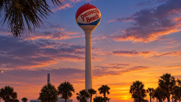 A tall, white column with a spherical top labeled 'Pensacola Beach.' - Sabine Yacht & Racquet Club 6C | Spectacular Pensacola Beachfront Views | Beach Svc (Pensacola Beach)