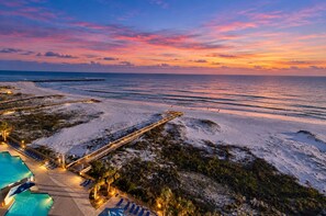 A resort with a pool area, lounge chairs, and a beach view. - Phoenix East 110 | Beachside Outdoor Pool | Gulf Views | Pickleball Court (Orange Beach)