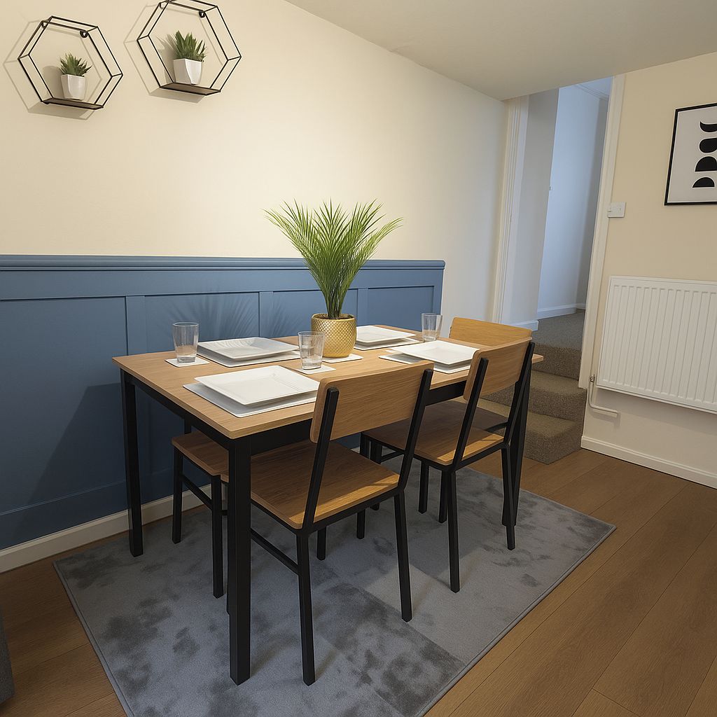 Un comedor con una mesa de madera, cuatro sillas, un tapete gris y dos decoraciones hexagonales con plantas.