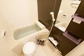 A bathroom with a bathtub, a toilet, a shower, and a sink. - Lamarie Haneda 403 (Ota Ku)