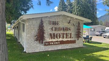 The Cedars Motel sign with a 'No Vacancy' notice.