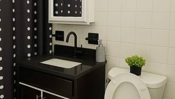 Shower, hair dryer, towels, shampoo