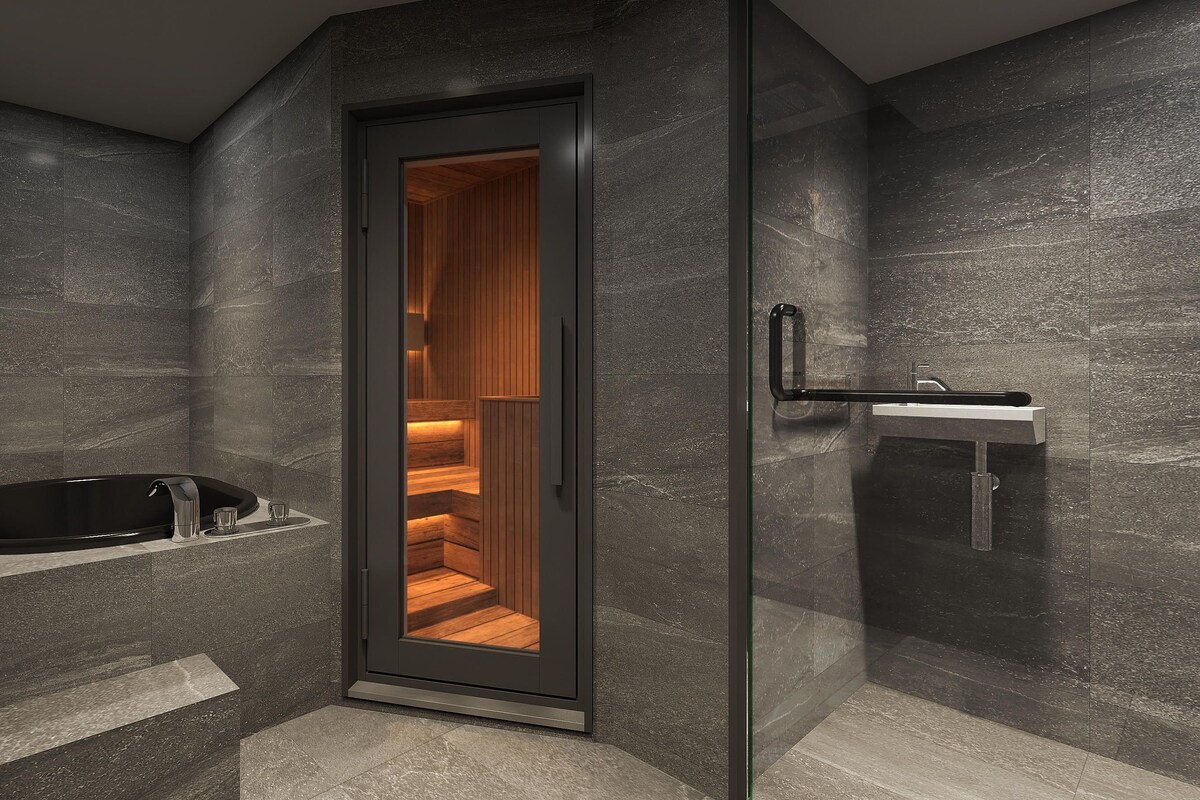 A modern bathroom with a glass-enclosed shower, a freestanding bathtub, and a minimalist sink.