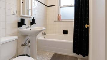 Shower, hair dryer, towels, shampoo
