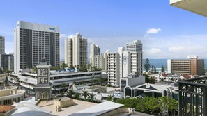 A high-rise hotel with multiple floors, a rooftop pool, and a view of the ocean. - Chevron Renaissance Apartment 1092 (Surfers Paradise)