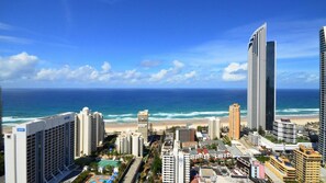 A coastal cityscape with high-rise buildings, a beach, and a clear blue sky. - Chevron Renaissance Apartment 2364 (Surfers Paradise)