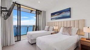 A hotel room with two beds, a large window with a view of the sea, and a painting on the wall. - Esplanade Soul Apartment 6102 (Surfers Paradise)