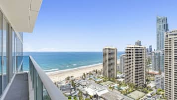 A high-rise building with a view of the beach and ocean.