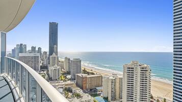 A high-rise building with a view of the beach and ocean.