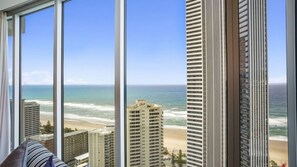 A high-rise building with a view of the beach and ocean. - Orchid Residences Apartment 22604 (Surfers Paradise)